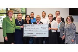 Elected members of the Snoqualmie Tribal Council meet with leaders from the Seattle Cancer Care Alliance to present a check for $1.4 million. From left Dr. Nancy Davidson, executive director and president SCCA, Suzanne Sailto, Snoqualmie Tribal Council, Jolene Williams, Snoqualmie Tribal secretary, Steve de los Angeles, Snoqualmie Tribal deputy secretary, Bob de los Angeles, Snoqualmie Tribal chairman, Michael Ross, Snoqualmie Tribal vice chair, Kari Glover, chair SCCA Board of Directors, Norm Hubbard, executive vice president SCCA, Linda Mattox, chair SCCA Board of Directors Development Committee, Dr. Terry McDonnell, vice president of clinical operations and chief nurse executive SCCA. Photo courtesy of the Snoqualmie Tribe.