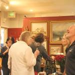 Locals taste wine in various shops throughout Finally Friday Art and Wine Walk. Madison Miller/staff photo.