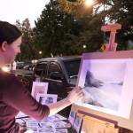 Jacqueline Tribble paints watercolor landscapes by flashlight. Madison Miller/staff photo.