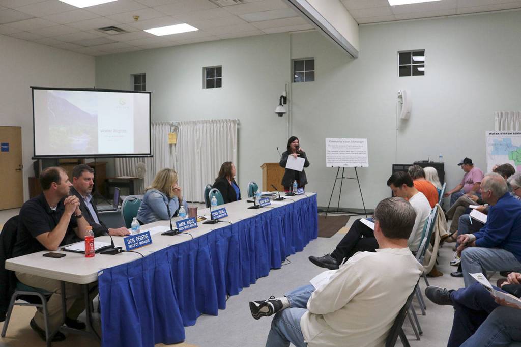 North Bend Staff kick off the meeting at Mount Si Senior Center with a presentation breaking down the city of North Bends water rights. Evan Pappas/Staff Photo