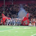 Mount Si football team charging into the Homecoming game. Photo courtesy of Calder Productions.