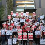 SVSD teachers, secretaries, SVEA and PSE members, and other supporters picket in front of Snoqualmie Valley City Hall before the Oct. 23 school board meeting for living wages of district secretaries. Madison Miller/staff photo.