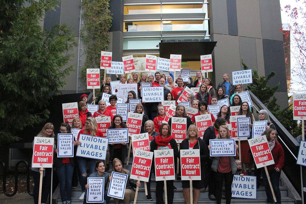 SVSD teachers, secretaries, SVEA and PSE members, and other supporters picket in front of Snoqualmie Valley City Hall before the Oct. 23 school board meeting for living wages of district secretaries. Madison Miller/staff photo.