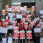 SVSD teachers, secretaries, SVEA and PSE members, and other supporters picket in front of Snoqualmie Valley City Hall before the Oct. 23 school board meeting for living wages of district secretaries. Madison Miller/staff photo.