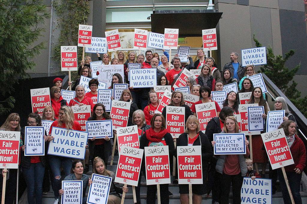 SVSD teachers, secretaries, SVEA and PSE members, and other supporters picket in front of Snoqualmie Valley City Hall before the Oct. 23 school board meeting for living wages of district secretaries. Madison Miller/staff photo.