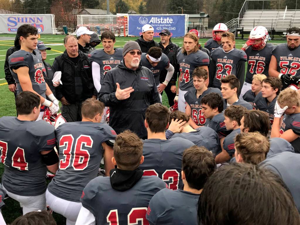 Mount Si Wildcats head football coach Charlie Kinnune, center, addresses his players following their convincing 42-0 victory against the Rogers Rams in a winner-to-state, loser-out playoff game on Nov. 3 in Snoqualmie. Shaun Scott/staff photo