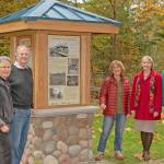 Ed Hazen, Sue Holbink, and Mike Butine of Raging River Conservation Group and Ruth Pickering and Donna Driver-Kummen of Fall City Historical gathered to celebrate the sign installation. Photo by Scott Massey.
