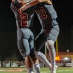 Mount Si Wildcats senior quarterback Cale Millen (No. 10) and sophomore running back Cole Norah (No.2) celebrate after Norah scored on a 5-yard touchdown run with 8:02 left in regulation, cutting Puyallups lead to 33-28. Patrick Krohn/Patrick Krohn Photography