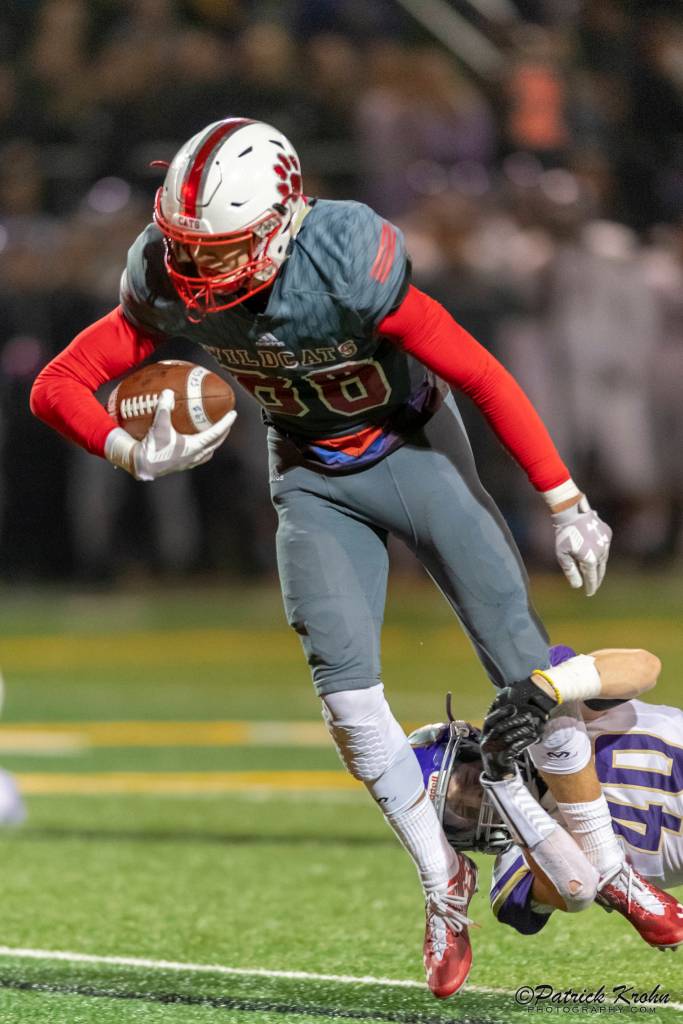 Mount Si Wildcats senior wide receiver Jonny Barrett (pictured) tries to escape a tackle from Puyallup defensive back Kyler Johnson. Puyallup defeated Mount Si 47-34 in the Class 4A state quarterfinals. Photo courtesy of Patrick Krohn/Patrick Krohn Photography