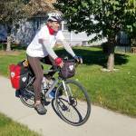 Kirk Gillock of North Bend on his 4,233 mile cycle tour across 13 states to spread the message of love, unity and balance. Photo courtesy of Kirk Gillock.