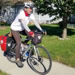 Kirk Gillock of North Bend on his 4,233 mile cycle tour across 13 states to spread the message of love, unity and balance. Photo courtesy of Kirk Gillock.