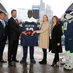 Snoqualmie Casino and the Seattle Seahawks officially form advertising partnership. From left: Casino chief marketing officer Stanford Le, Casino CEO Brian Decorah, former Seahawks player Randall Morris, Seahawks senior VP of revenue Amy Sprangers, and director of sales and corporate partnerships Gina Martinez Todd. Courtesy Photo