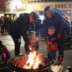 Brothers Chase and Nicky Iannuccilli roast marshmallows over one of the fire pits set up on North Bend Way at the citys Holly Days event. Evan Pappas/Staff Photo