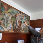 Tolt Historical Society member Jackie Norris explains the history behind the 1938 painting Snoqualmie Valley Industries by Beryl Adair Trezise. Evan Pappas/Staff Photo