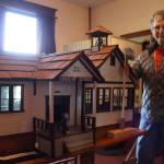 Jackie Norris stands with the miniature replica of the Vincent Schoolhouse made by William Quaale. The schoolhouse was built in 1905 and closed in 1942. Evan Pappas/Staff Photo