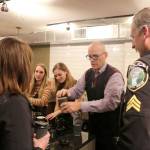 Volunteers serve coffee to community members as the film crew prepares to surprise the Trail Youth owners. Evan Pappas/Staff Photo