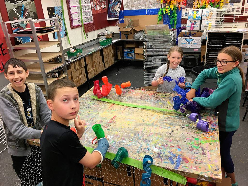 Julie Lagaces seventh grade art students work on their Chihuly-inspired chandelier. From left: Josh Liebes, Brandon Wallace, Isabel Phalen, Audrey Newbrey-Smith. Photos courtesy of Julie Lagace.