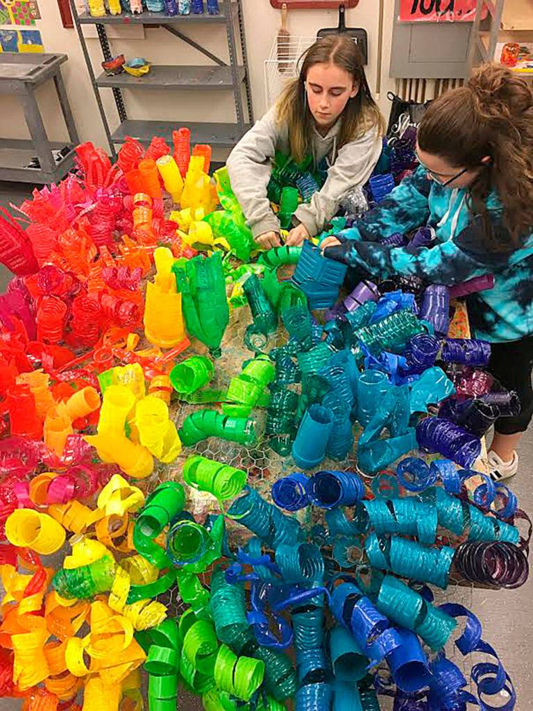 Eighth graders Nicole Alexander and Grace Carnes were among the few students who continued working on the project after the school year ended. Photo courtesy of Julie Lagace