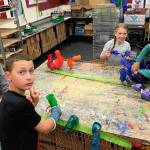 Julie Lagaces seventh grade art students work on their Chihuly-inspired chandelier. From left: Josh Liebes, Brandon Wallace, Isabel Phalen, Audrey Newbrey-Smith. Photos courtesy of Julie Lagace.