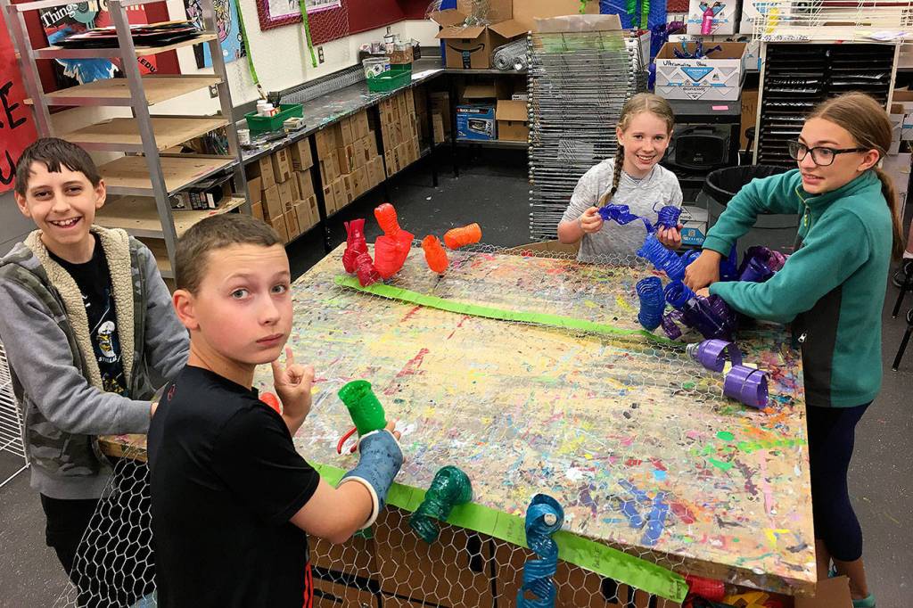 Julie Lagaces seventh grade art students work on their Chihuly-inspired chandelier. From left: Josh Liebes, Brandon Wallace, Isabel Phalen, Audrey Newbrey-Smith. Photos courtesy of Julie Lagace.