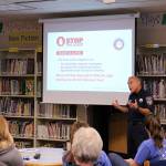 Snoqualmie Fire Dept. Lt. Robert Angrisano shares ways to stop uncontrollable bleeding in case of a school shooting or natural disaster with Opstad Elementary teachers and staff. Madison Miller/staff photo.