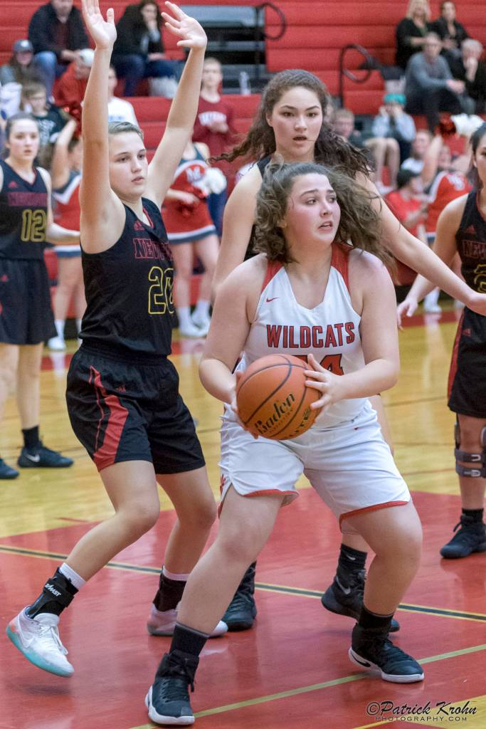 Mount Si Wildcats senior Abigail Triou, center, controls the action in the paint against the Newport Knights. Newport defeated Mount Si, 43-37, on Jan. 16 in Snoqualmie. Photo courtesy of Patrick Krohn/Patrick Krohn Photography