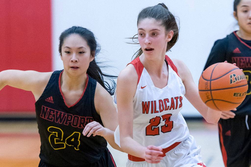 Mount Si Wildcats freshman Lauren Glazier, right, drives toward the hoop while being guarded by Newport defender Ashley Lau. Glazier finished with a team-high 11 points in the loss. Photo courtesy of Patrick Krohn/Patrick Krohn Photography