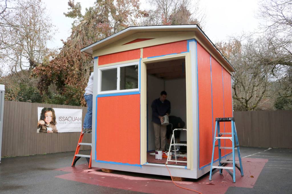 Volunteers in Issaquah finish a tiny house last December before donating it to the Low Income Housing Institutes newest village for homeless residents in Olympia. The 8-foot by 12-foot house featured insulation, electricity, heat, windows, and a lockable door. Evan Pappas/Staff photo
