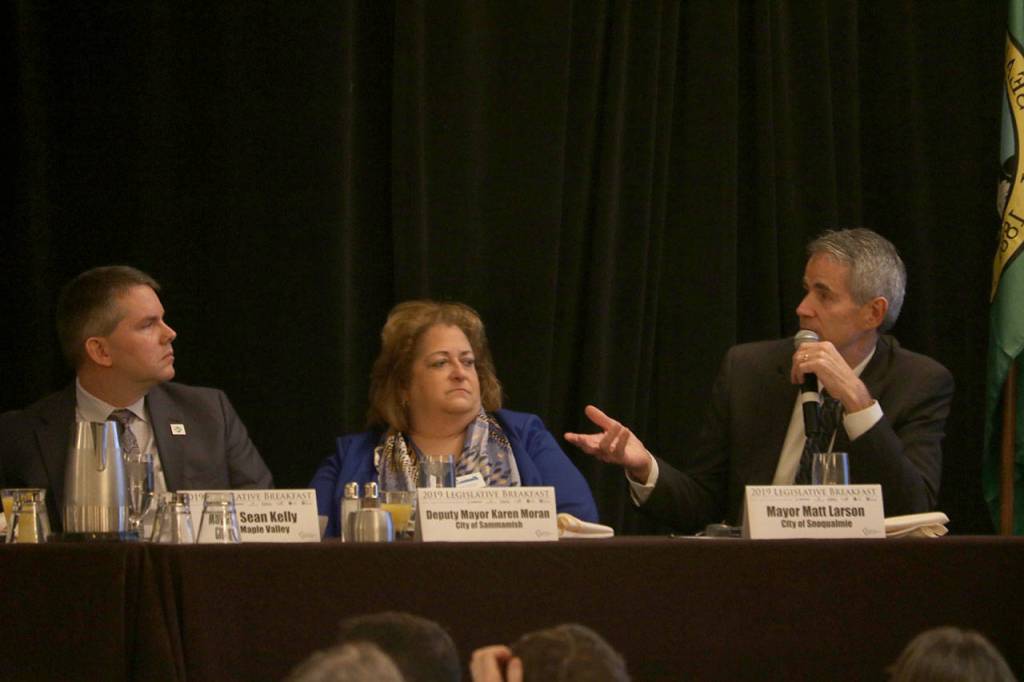 Snoqualmie Mayor Matt Larson talks about the need for tax reform in the state in order to address funding for infrastructure. From left: Maple Valley Mayor Sean Kelly, Sammamish Deputy Mayor Karen Moran, and Snoqualmie Mayor Matt Larson. Evan Pappas/Staff Photo