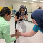 Fauzia Lala works with some of her Level Four students at a class in Redmond on Jan. 15. Katie Metzger/staff photo