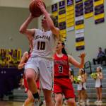 Mount Si Wildcats junior guard Carly Britton, right, tries to chase down Issaquah senior Luci Stewart, center, in a matchup between rivals on Jan. 25 in Issaquah. Issaquah defeated Mount Si 55-23. Photo courtesy of Don Borin/Stop Action Photography
