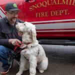 Lt. Jake Fouts takes therapy dog Phoebe out for a morning game of fetch. Ashley Hiruko/staff photo