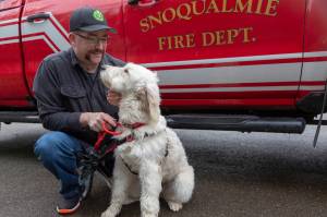 Lt. Jake Fouts takes therapy dog Phoebe out for a morning game of fetch. Ashley Hiruko/staff photo