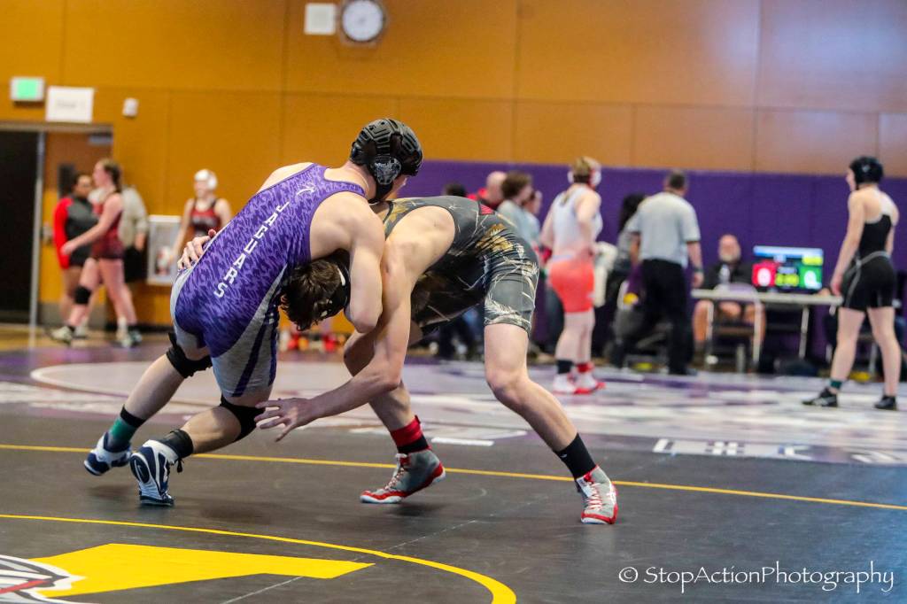 Mount Si 170-pound wrestler Sage Phelps, right, pictured wrestling against North Creeks Matt Kendrick in the finals, earned second place in his weight class at the 4A KingCo wrestling tournament on Feb. 2 at North Creek High School. Photo courtesy of Don Borin/Stop Action Photography