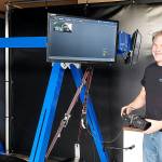 Portal VR founder Tim Harader sets up a station for Glider Island, an VR experience that places people in a hang glider (Drew Stuart/Staff Photo)