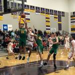 Mount Si senior Jonny Barrett (No. 32) battles for position in the paint as Richland senior Colten Northrop corrals a rebound in a regional playoff game on Feb. 23 at Issaquah High School. Mount Si defeated Richland 60-54. Shaun Scott, staff photo