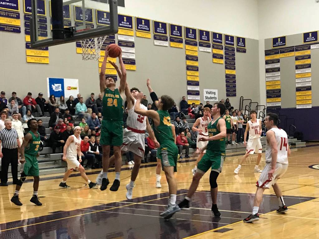 Mount Si senior Jonny Barrett (No. 32) battles for position in the paint as Richland senior Colten Northrop corrals a rebound in a regional playoff game on Feb. 23 at Issaquah High School. Mount Si defeated Richland 60-54. Shaun Scott, staff photo