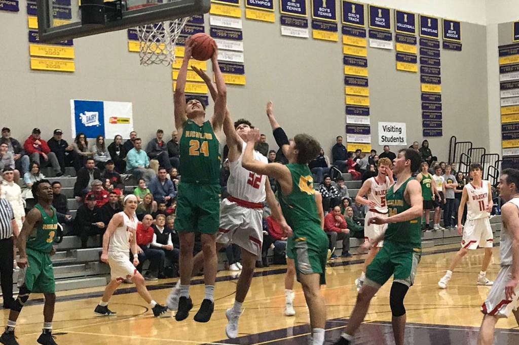 Mount Si senior Jonny Barrett (No. 32) battles for position in the paint as Richland senior Colten Northrop corrals a rebound in a regional playoff game on Feb. 23 at Issaquah High School. Mount Si defeated Richland 60-54. Shaun Scott, staff photo