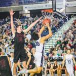 Mount Si Wildcats senior Brett Williams, center, tries to block Gonzaga Preps Sheadon Byrd on a drive to the basket in the Class 4A state championship game on March 2 at the Tacoma Dome. Gonzaga Prep defeated Mount Si 69-43. Photo courtesy of Don Borin/Stop Action Photography