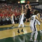 Mount Sis Jabe Mullins unleashes a shot at the 4A state tournament with the Wildcat sea-of-red crowd to his side. He is the 4A KingCo most valuable player. Courtesy of Calder Productions