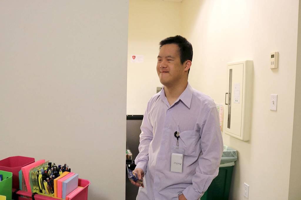 Arthur Hwang is also an AtWork! client hired at the law firm. Hwang works loading paper into printing machines and cleaning the staff room. Stephanie Quiroz/staff photo