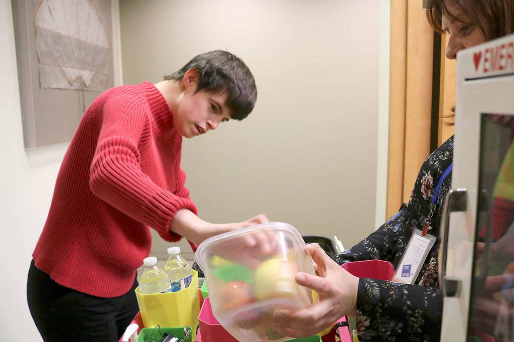 Paige Bisbees day at the law firm starts off by loading up her cart with snacks and office supplies. Stephanie Quiroz/staff photo.