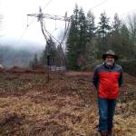 Thomas Speckhardt stands on his property line next to a power line easement in Issaquah. The line was recently reclaimed by Bonneville Power Administration from Puget Sound Energy and the company is hoping to expand vegetation clearance around it. Aaron Kunkler/staff photo