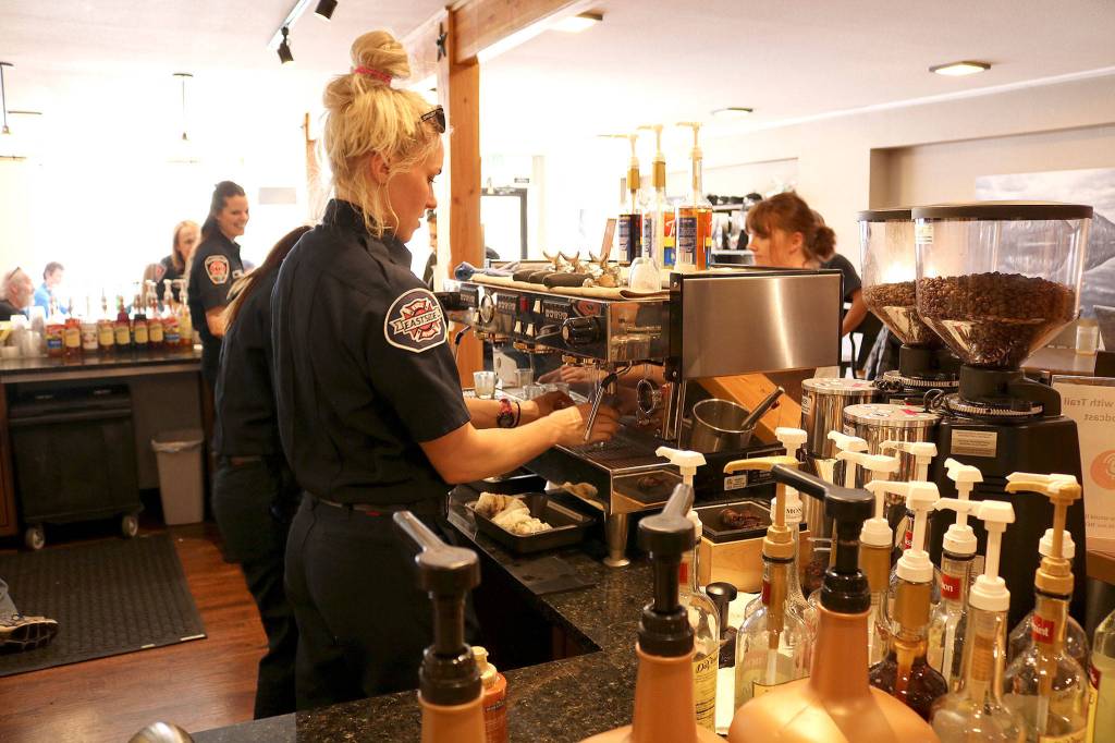 Eastside firefighter Danika Lawson making coffee at the first brew off event at the Trail Youth Coffee Home on March 19. Stephanie Quiroz/staff photo