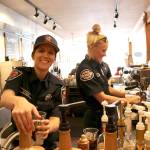 Snoqualmie volunteer firefighter Kristina Myers made drinks at the Boots vs. Badges brew off event on March 19. Stephanie Quiroz/staff photo