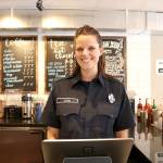 Snoqualmie firefighter Sara York took orders at Boots vs. Badges brew off event on March 19. Stephanie Quiroz/staff photo