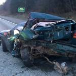 One dead after bus collides into disabled vehicle on I-90