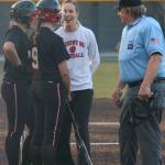Mount Si head coach Lauren Dumoulin jokes with her players and an umpire. Andy Nystrom / staff photo