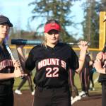 From left, Samantha Simmons, Abby Gronewald and Molly Wilbourne get prepared for a recent game against North Creek. Andy Nystrom / staff photo
