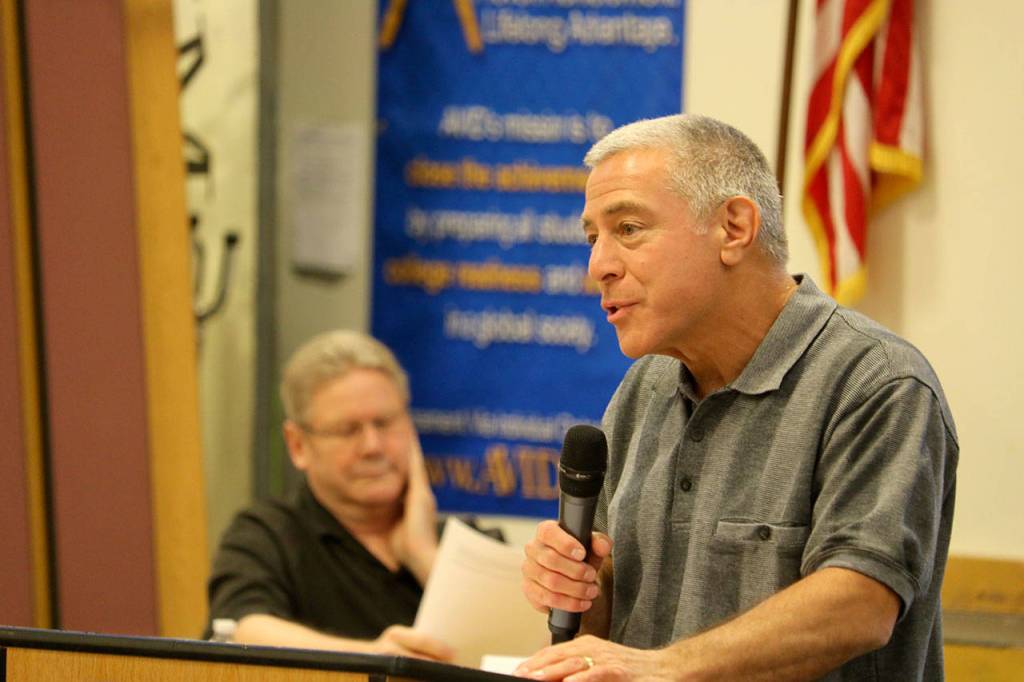 Robert Angrisano presents the opening argument for the anti-merger side of the debate. Evan Pappas/staff photo